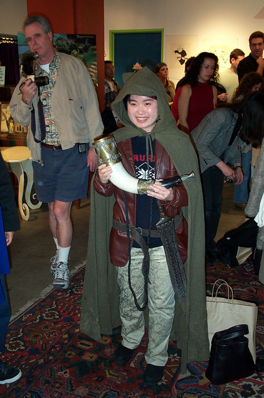 A Fan poses with the Horn of Gondor and Sam's scabbard and Sword - 531x800, 115kB