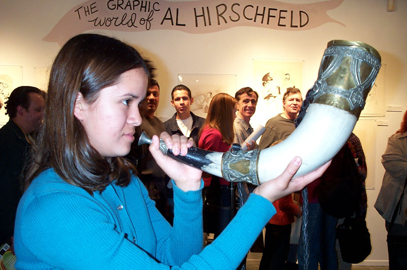 A fan prepares to let rip on the Horn of Gondor - 800x531, 100kB