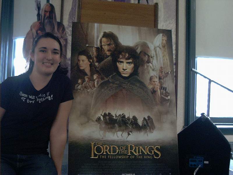 Posing with LOTR Poster at Book Discussion - 800x600, 49kB