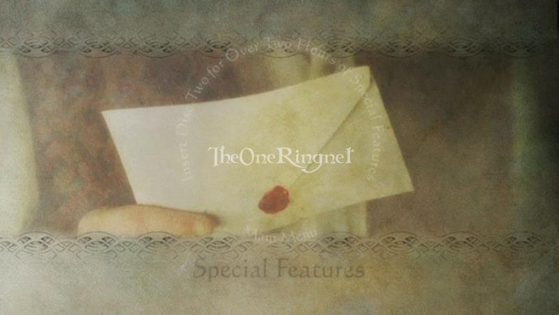 Frodo holding Bilbo's letter - 800x451, 37kB