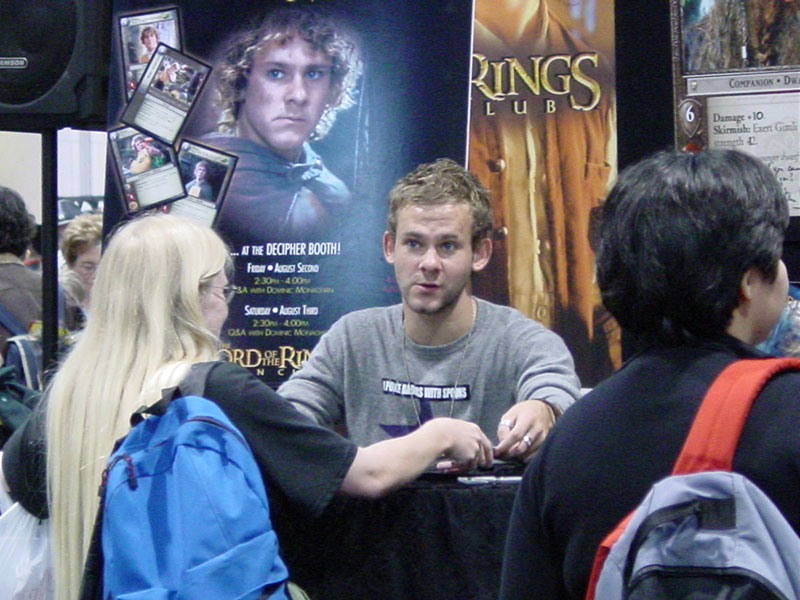 Dominic Monaghan Mans the Decipher Booth at Comic-Con 2002 - 800x600, 117kB