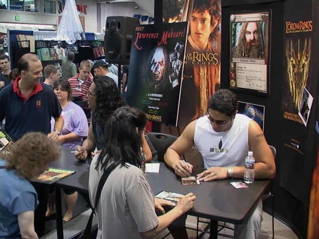 Sala Baker Signs a Decipher Card at ComicCon 2002 - 640x480, 98kB