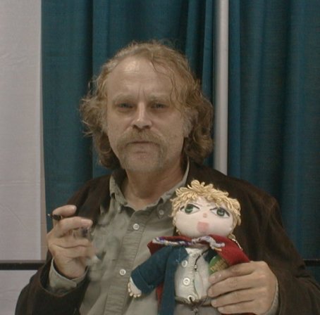 Brad Dourif and a Doll - 454x448, 30kB